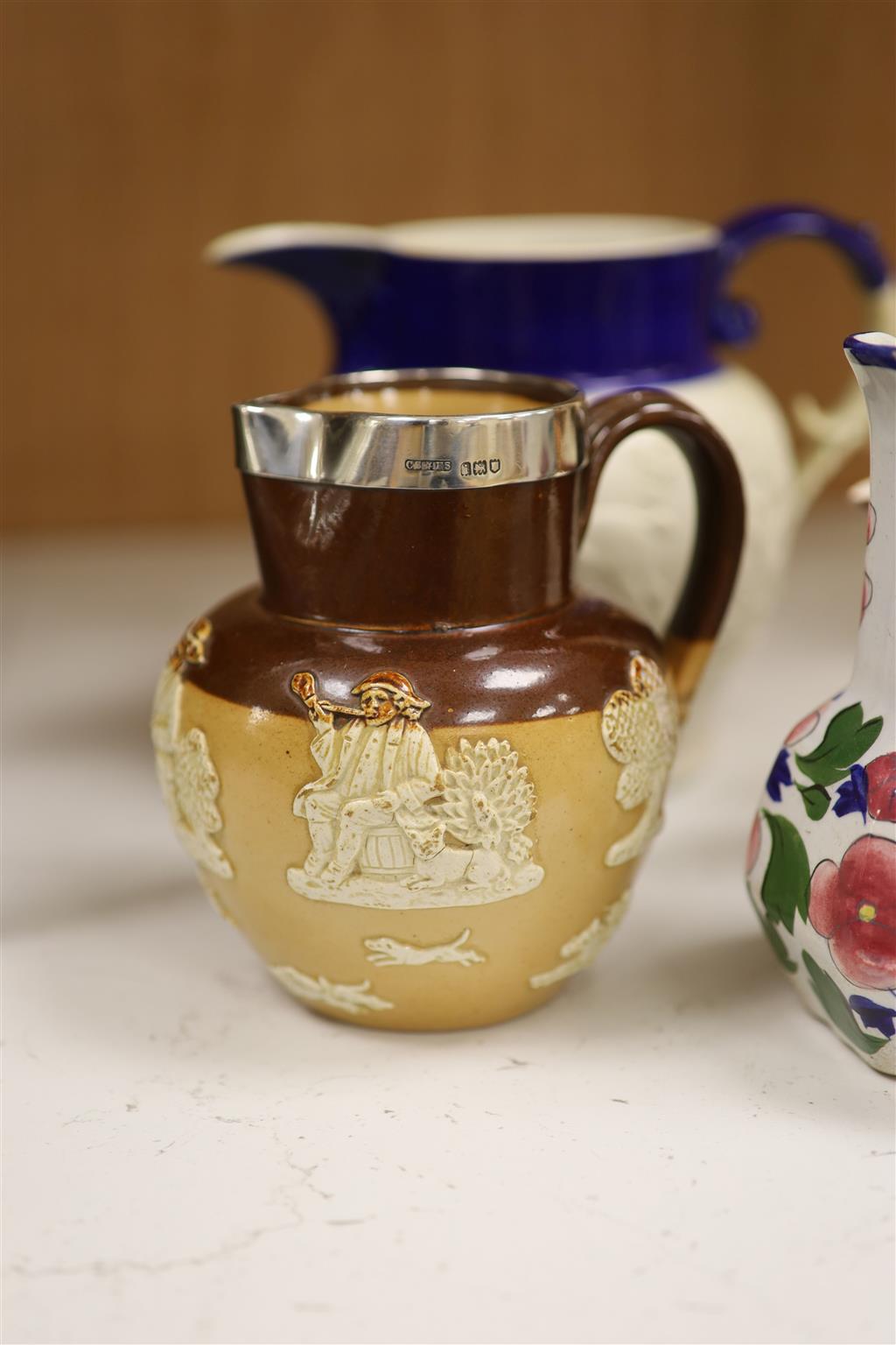 A Royal Doulton Lambeth silver rimmed jug and other various jugs including Copeland, lustreware etc.